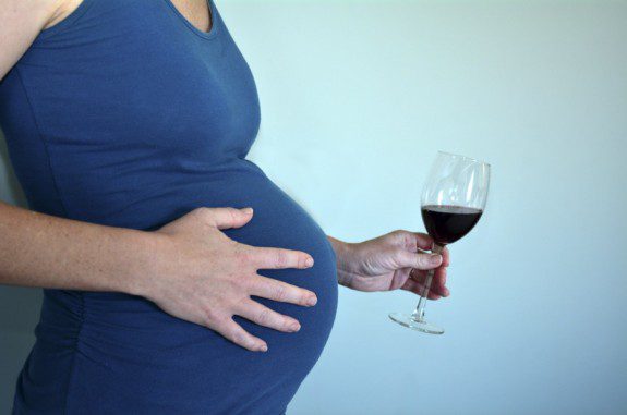 pregnant woman and wine glass